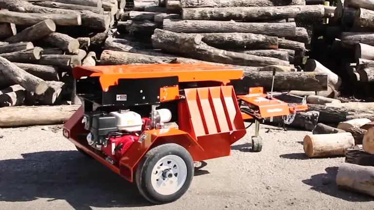 Wood-Mizer FS300 Log Splitter in operation amidst a pile of logs