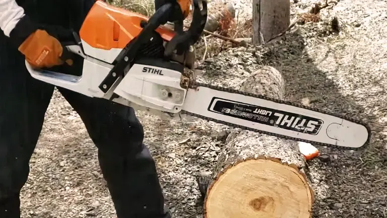 a Stihl MS 462 C-M chainsaw to cut a piece of wood