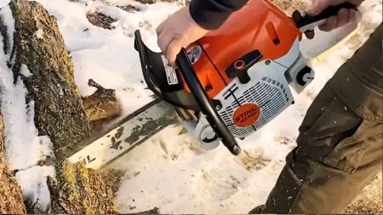 person using a Stihl MS 462 C-M chainsaw to cut a tree trunk in a snowy environment