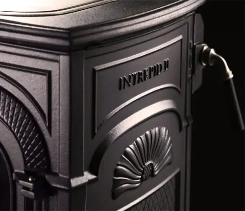 Close-up of a black Vermont Castings Intrepid II wood stove with intricate designs