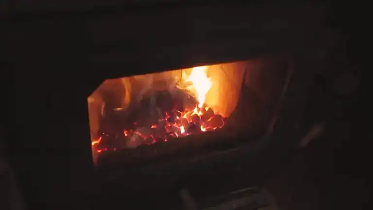 Burning coals in wood stove.