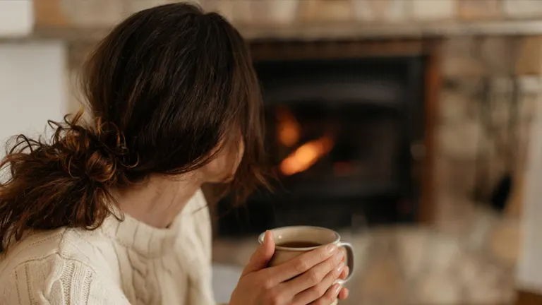 Drinking Coffee in front of Wood Stove