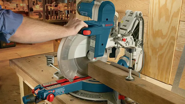A Bosch GCM12SD 12-inch Dual-Bevel Glide Miter Saw with a blade in place and the saw arm retracted, ready for a miter cut