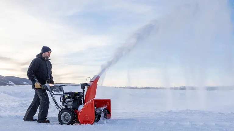 Ariens Deluxe 28 SHO Snow Blower operating in road