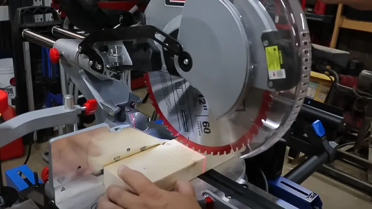 Close-up of ADMIRAL 12" Dual Bevel Sliding Compound Miter Saw cutting wood