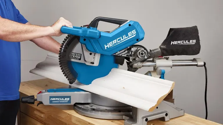 Hercules HE74 12" Dual-Bevel Sliding Compound Miter Saw with Precision LED Shadow Guide cutting wood on a workbench