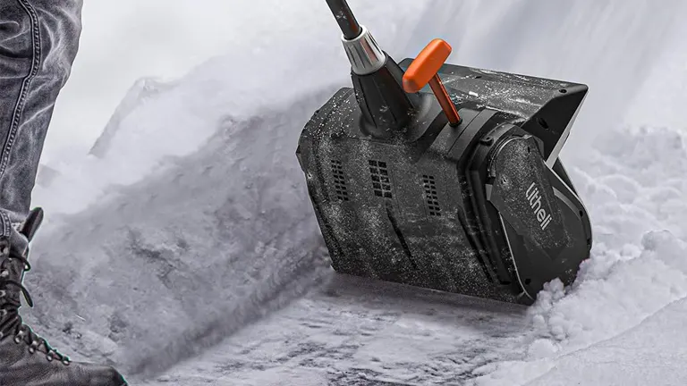 Litheli 13-Inch Battery Powered Snow Blower on a snow-covered sidewalk