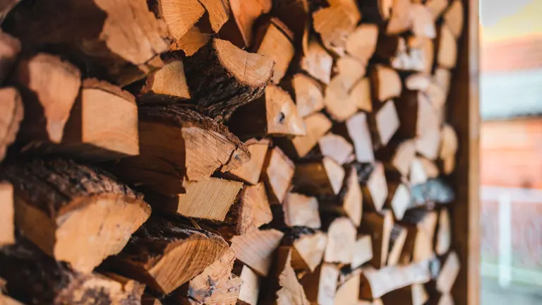 Neatly stacked firewood for a 2023 Firewood Business guide