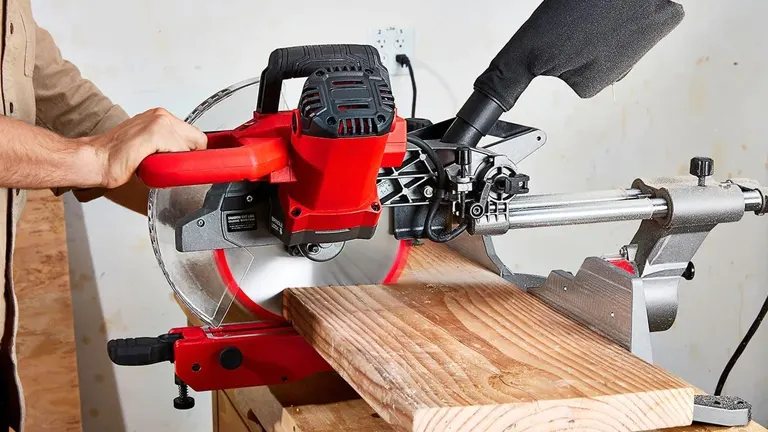 Person using Bauer 20744E-B 12” Dual Bevel Sliding Compound Miter Saw in a workshop