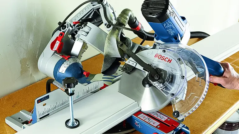 Bosch CM10GD 10” Dual-Bevel Glide Miter Saw on a workbench, ready for use