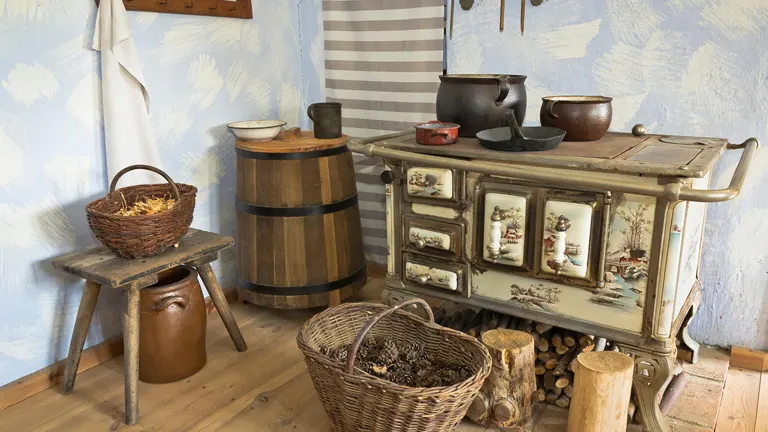 Vintage wood burning stove in a rustic kitchen.