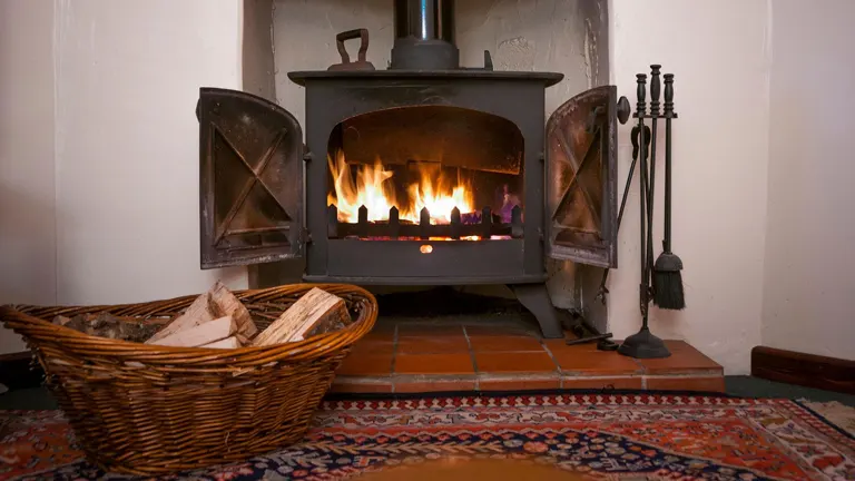 Fireplace with a basket of firewood.