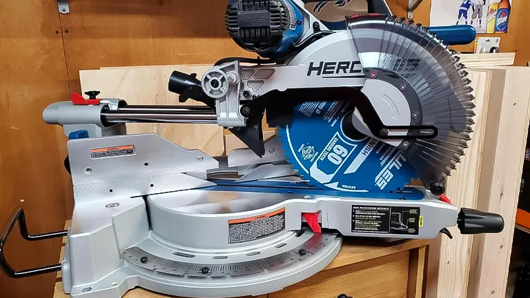 Hercules HE74 12" Dual-Bevel Sliding Compound Miter Saw with Precision LED Shadow Guide on a wooden workbench
