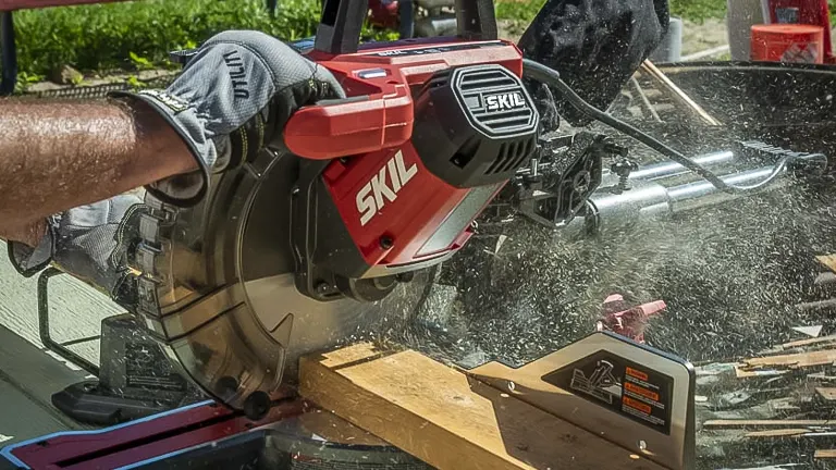 Skil MS6305-00 10” Dual Bevel Sliding Compound Miter Saw in use, cutting wood
