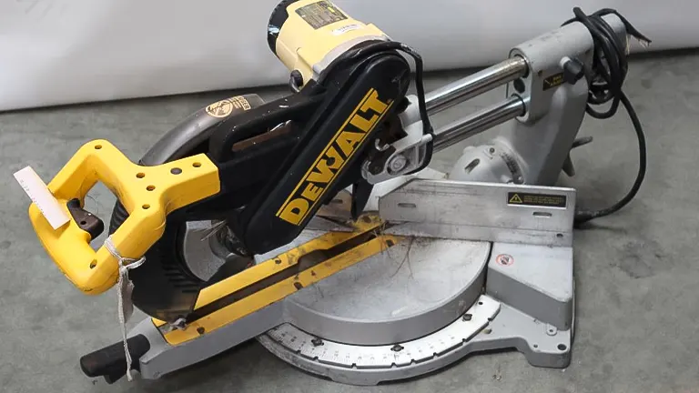 DeWalt DW708 12” Double-Bevel Sliding Compound Miter Saw with yellow handle and black blade guard on gray background