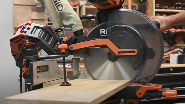 Ridgid R4251 12" Dual-Bevel Sliding Miter Saw cutting wood in a workshop