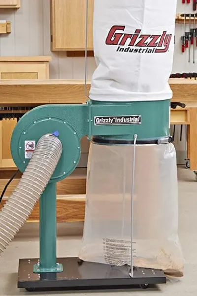 Grizzly G8027 1 HP Dust Collector in a workshop setting
