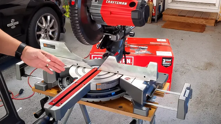 CRAFTSMAN CMXEMAX69434505 12" Single Bevel Sliding Compound Corded Miter Saw in use in a garage setting