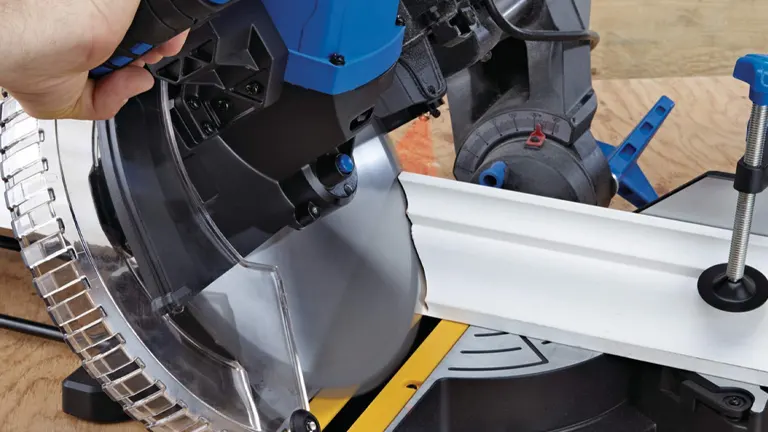 Close up of a blue and black Mastercraft 11G-305 15 Amp 12" Dual-Bevel Sliding Miter Saw with Laser on a wooden surface