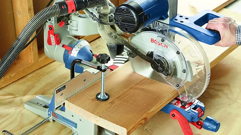 Bosch CM10GD 10” Dual-Bevel Glide Miter Saw in use on a wooden plank