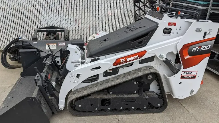 Bobcat MT100 mini track loader parked on a concrete surface