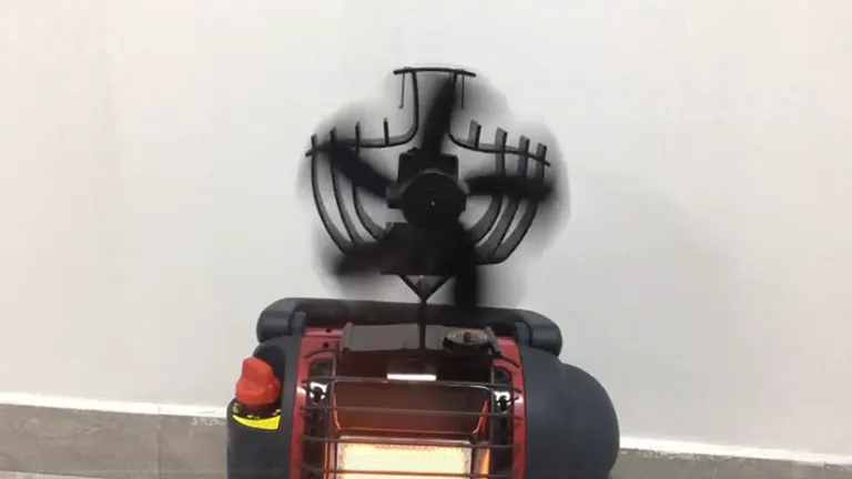 CWLAKON heat powered stove fan on top of a glowing red heater, casting a shadow on the wall