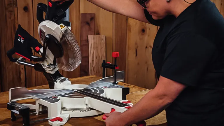 JET JMS-10X 707210 10-Inch Dual-Bevel Compound Miter Saw in use on a wooden board
