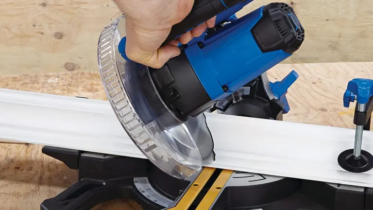 Blue and silver Mastercraft MS185 7-1/4 in Single-Bevel Sliding Compound Miter Saw cutting a white wooden board