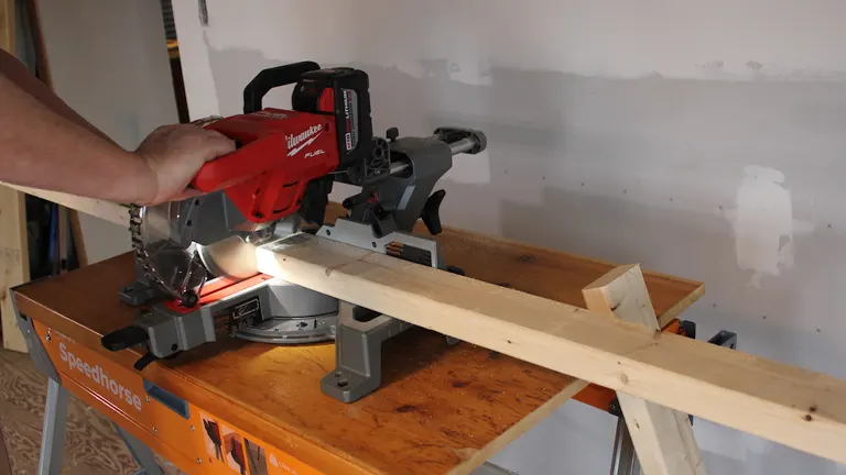Milwaukee 2733-20 M18 FUEL 7-1/4-Inch Dual Bevel Sliding Compound Miter Saw on a wooden workbench