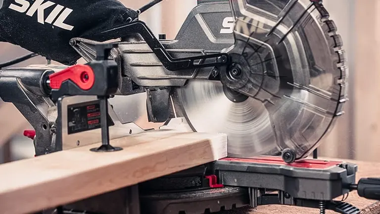 Skil MS6305-00 10” Dual Bevel Sliding Compound Miter Saw in action on a wooden plank