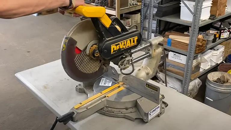 DeWalt DW708 12” Double-Bevel Sliding Compound Miter Saw in use cutting wood in a workshop