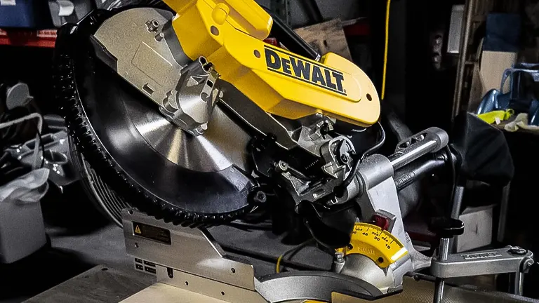 DeWalt DWS779 Double-Bevel Sliding Compound Miter Saw in a workshop setting.