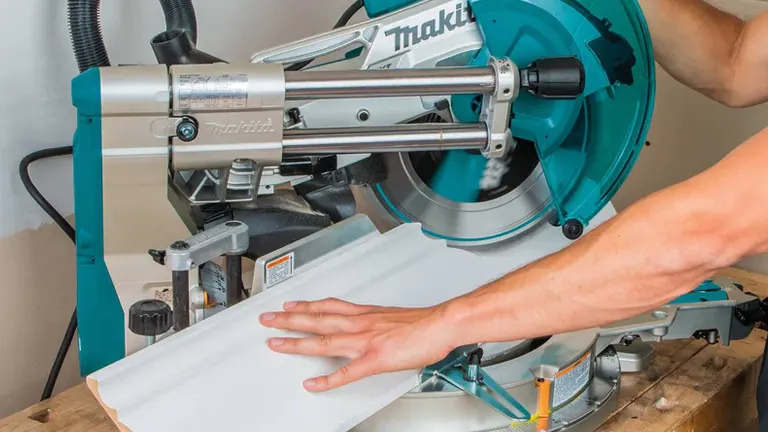 Makita LS1219L 12" Dual-Bevel Sliding Compound Miter Saw in use on workbench.