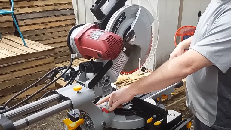 Chicago Electric 61969 12” Double-Bevel Sliding Compound Miter Saw cutting wooden board on deck.