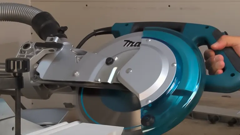 Blue and silver Makita LS1018 10” Dual Slide Compound Miter Saw in use