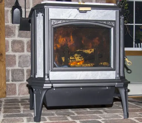A wood burning stove with a fire burning inside it.
