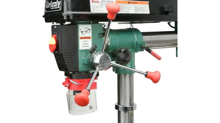 Grizzly G7945 Benchtop Radial Drill Press with safety labels and a metal base.