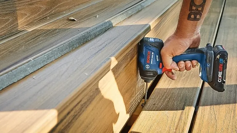 BOSCH GDR18V-1860CB25 18V Hex Impact Driver in use on a wooden deck.
