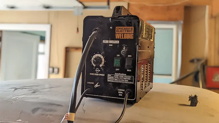 Chicago Electric Welding 225 Amp-AC 240V Stick Welder on workbench in a garage