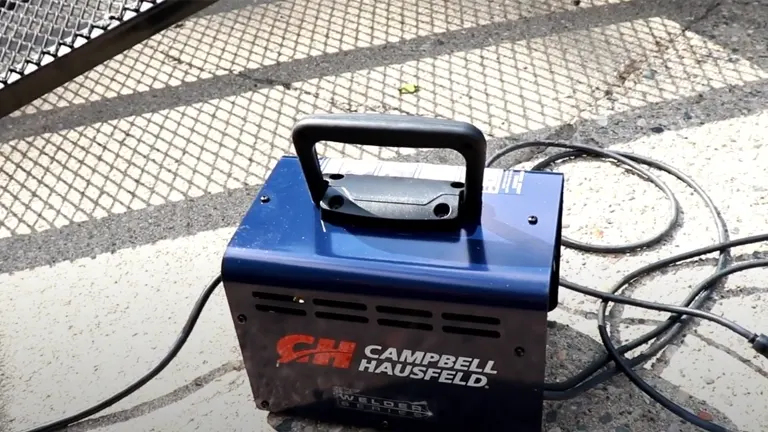 Campbell Hausfeld 115v Stick Welder with Accessory Kit on a concrete surface