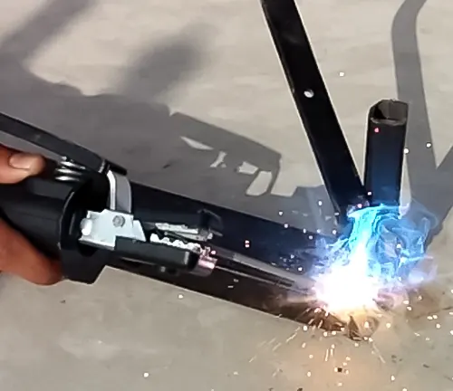 Person welding with Century Inverter Arc 120 Stick Welder MODEL K2789-2