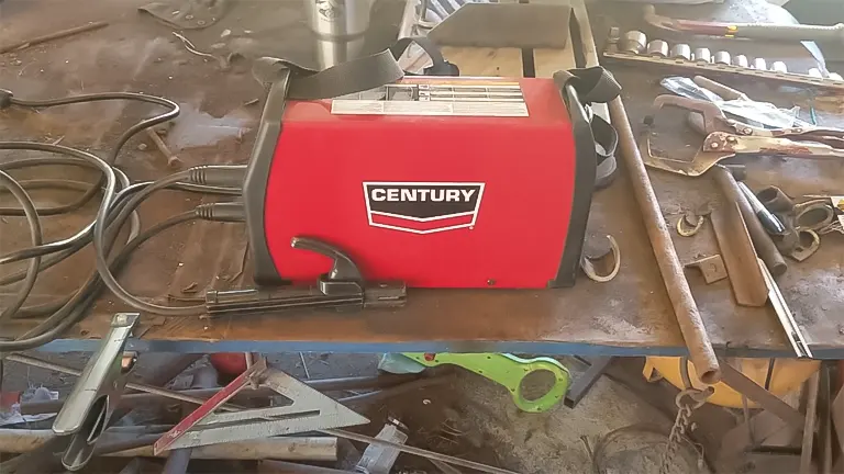 Century Inverter Arc 120 Stick Welder on a workbench with tools