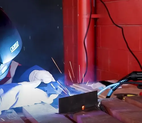 Person welding with Cigweld EasyWeld 160 MIG Stick Welder and Torch