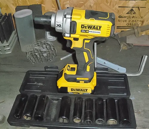 DeWalt drill and various drill bits on a black tray.