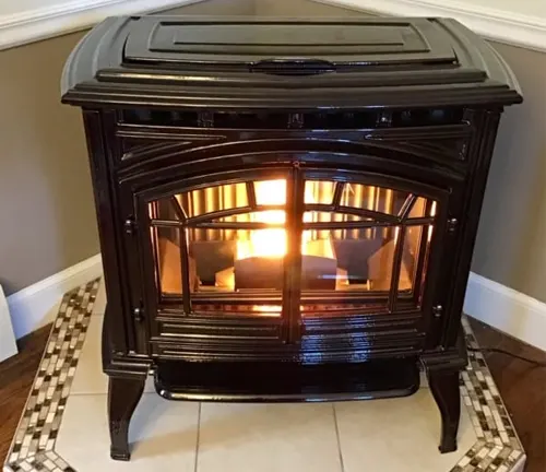Black wood-burning stove with a fire inside.