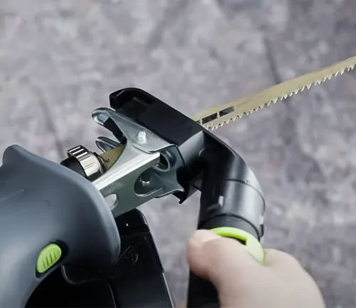 Close-up of Festool Cordless Reciprocating Saw RSC 18 EB-Basic 576947 in use on black material