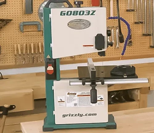 Grizzly brand bandsaw in a workshop.