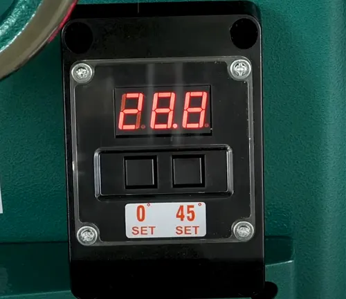Digital display with red numbers on green background