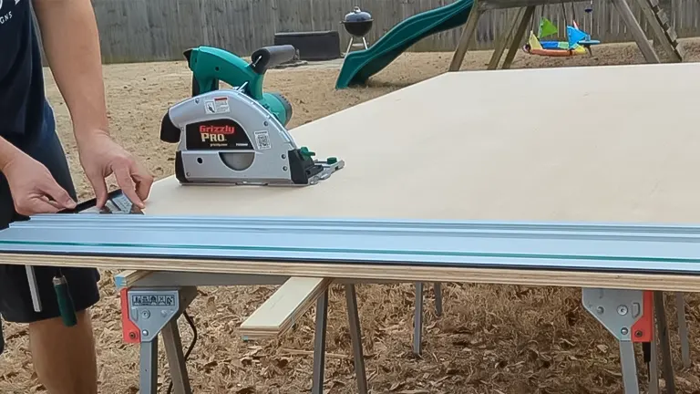 Person using a Grizzly Pro circular saw to cut plywood.