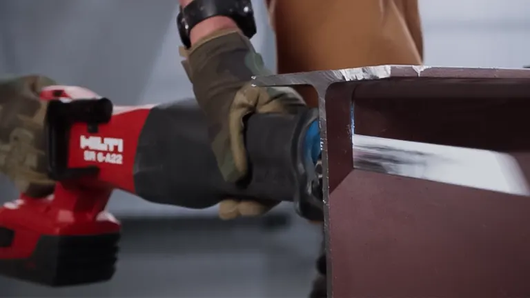 Close-up of Hilti WSR 1000 Reciprocating Saw in use, cutting through a brown metal beam